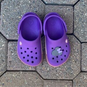 Crocs girls purple and pink clogs slip on. Size 6-7. Used